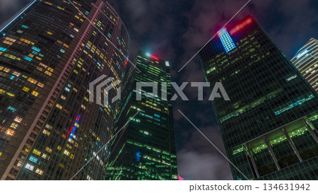 Looking up perspective of modern business skyscrapers glass and sky view landscape of commercial building in central city timelapse hyperlapse 134631942