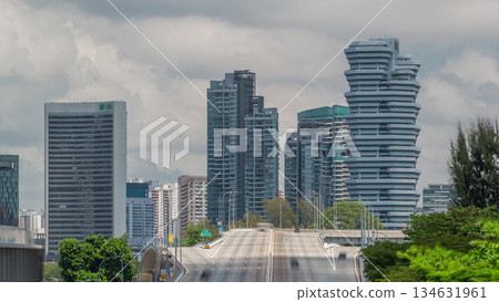 Traffic with cars on a street and urban scene in the central district of Singapore timelapse 134631961