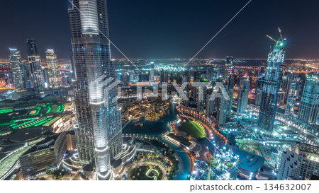 Panoramic skyline view of Dubai downtown with mall, fountains and Burj Khalifa aerial night timelapse Panoramic skyline view of Dubai downtown with mall, fountains and Burj Khalifa aerial night timelapse 134632007