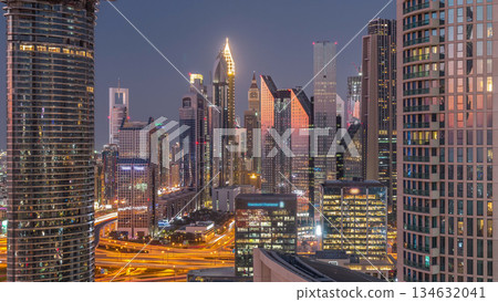 Dubai International Financial Centre district with modern skyscrapers day to night timelapse Dubai International Financial Centre district with modern skyscrapers day to night timelapse 134632041