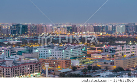 Deira modern and old buildings canal aerial view of Dubai Creek day to night timelapse. Deira modern and old buildings canal aerial view of Dubai Creek day to night timelapse. 134632060