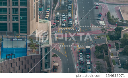 Aerial view of a road intersection in a big city timelapse. 134632071
