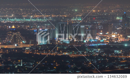 Aerial view of neighborhood Deira and Dubai creek with typical old and modern buildings night timelapse. Aerial view of neighborhood Deira and Dubai creek with typical old and modern buildings night timelapse. 134632089