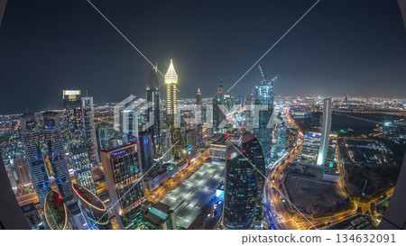 Skyline of the buildings of Sheikh Zayed Road and DIFC aerial night timelapse in Dubai, UAE. Skyline of the buildings of Sheikh Zayed Road and DIFC aerial night timelapse in Dubai, UAE. 134632091
