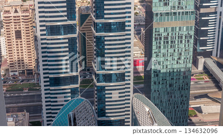 Skyline view of the buildings of Sheikh Zayed Road and DIFC aerial timelapse in Dubai, UAE. Skyline view of the buildings of Sheikh Zayed Road and DIFC aerial timelapse in Dubai, UAE. 134632096