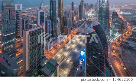 Skyline of the buildings of Sheikh Zayed Road and DIFC aerial day to night timelapse in Dubai, UAE. Skyline of the buildings of Sheikh Zayed Road and DIFC aerial day to night timelapse in Dubai, UAE. 134632100