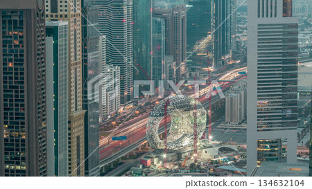 Construction site of the Museum of the Future aerial night to day timelapse, next iconic building of Dubai. 134632104
