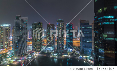 Residential and office buildings in Jumeirah lake towers district night timelapse in Dubai Residential and office buildings in Jumeirah lake towers district night timelapse in Dubai 134632107