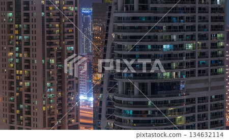Residential and office buildings in Jumeirah lake towers district night timelapse in Dubai Residential and office buildings in Jumeirah lake towers district night timelapse in Dubai 134632114