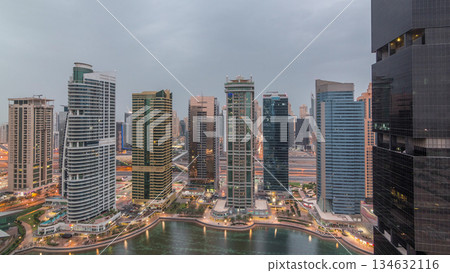 Residential and office buildings in Jumeirah lake towers district night to day timelapse in Dubai Residential and office buildings in Jumeirah lake towers district night to day timelapse in Dubai 134632116