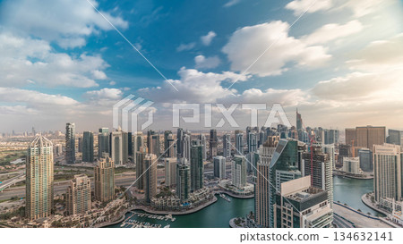 Dubai Marina skyscrapers and jumeirah lake towers view from the top aerial timelapse in the United Arab Emirates. Dubai Marina skyscrapers and jumeirah lake towers view from the top aerial timelapse in the United Arab Emirates. 134632141