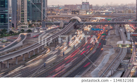 Aerial top view to Sheikh Zayed road near Dubai Marina and JLT day to night timelapse, Dubai. Aerial top view to Sheikh Zayed road near Dubai Marina and JLT day to night timelapse, Dubai. 134632168