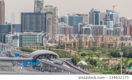 Dubai Golf Course with a cityscape of Greens and tecom districts at the background aerial timelapse 134632175