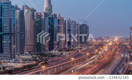 Aerial top view to Sheikh Zayed road near Dubai Marina and JLT night to day timelapse, Dubai. Aerial top view to Sheikh Zayed road near Dubai Marina and JLT night to day timelapse, Dubai. 134632185
