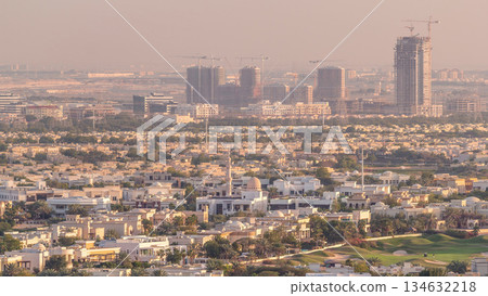 Aerial view to villas and houses near Golf course with lakes timelapse. Aerial view to villas and houses near Golf course with lakes timelapse. 134632218