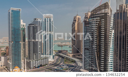 View of various skyscrapers and towers in Dubai Marina from above aerial timelapse 134632254