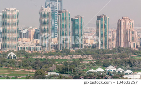 Dubai Golf Course with a cityscape of Greens and tecom districts at the background aerial timelapse 134632257