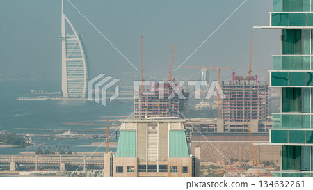 Modern skyscrapers in Jumeirah beach residence in Dubai, JBR aerial timelapse Modern skyscrapers in Jumeirah beach residence in Dubai, JBR aerial timelapse 134632261