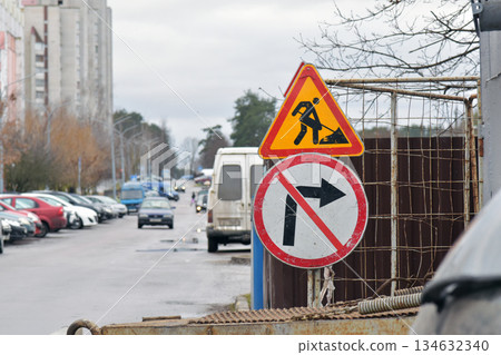 Road work and no right turn traffic signs at construction site 134632340