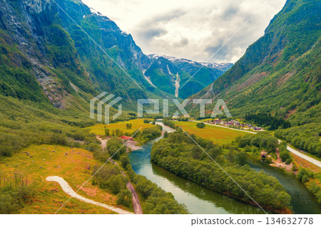 View from above of mountain valley Gudvangen and Naeroydanselvi river. Beautiful nature of Norway View from above of mountain valley Gudvangen and Naeroydanselvi river. Beautiful nature of Norway 134632778