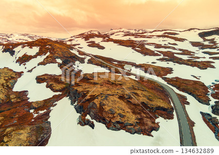 Aerial view of snow-covered mountain in summer. High mountain road Bjorgavegen. Aurlandsvegen, Aurland, Norway 134632889