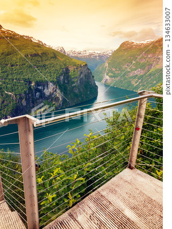 Mountain landscape, view at fjord from Ornesvingen Viewpoint at sunset. Beautiful nature of Norway. Geiranger fjord Mountain landscape, view at fjord from Ornesvingen Viewpoint at sunset. Beautiful nature of Norway. Geiranger fjord 134633007