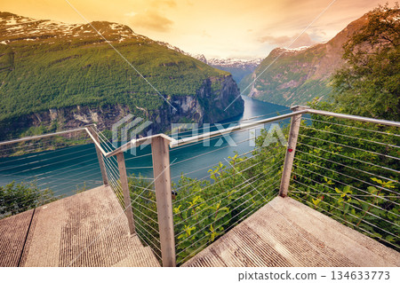 Mountain landscape, view at fjord from Ornesvingen Viewpoint at sunset. Beautiful nature of Norway. Geiranger fjord Mountain landscape, view at fjord from Ornesvingen Viewpoint at sunset. Beautiful nature of Norway. Geiranger fjord 134633773