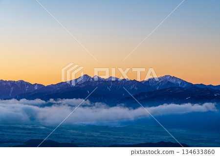 Winter sunrise in the Southern Alps from the summit of Mount Kurumayama on the Kirigamine Plateau Winter sunrise in the Southern Alps from the summit of Mount Kurumayama on the Kirigamine Plateau 134633860