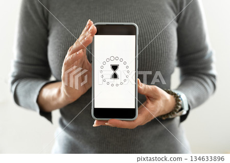 Girl Showing Smartphone With Loading Process Girl Showing Smartphone With Loading Process 134633896