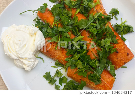 Delicious Enchiladas with Fresh Cilantro and Sour Cream Delicious Enchiladas with Fresh Cilantro and Sour Cream 134634317