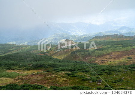 Hokkaido's highest peak, Mount Asahi in early autumn 134634378