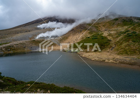 Hokkaido's highest peak, Mount Asahi in early autumn Hokkaido's highest peak, Mount Asahi in early autumn 134634404