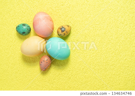 Painted Easter eggs on yellow background. Happy Easter. Painted Easter eggs on yellow background. Happy Easter. 134634746