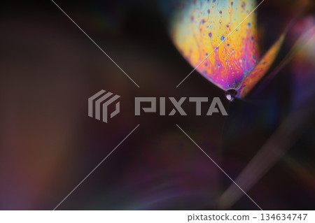 Rainbow flat film of liquid in macro, bright liquid surface, interference pattern, Bubbles in macro, connection of bubbles in macro, cell from liquid, macro abstraction 134634747