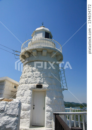 Ohamasaki Lighthouse shining against the blue sky Ohamasaki Lighthouse shining against the blue sky 134634772