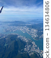 A view of the sea, land and sky seen from the window of an airplane 134634806