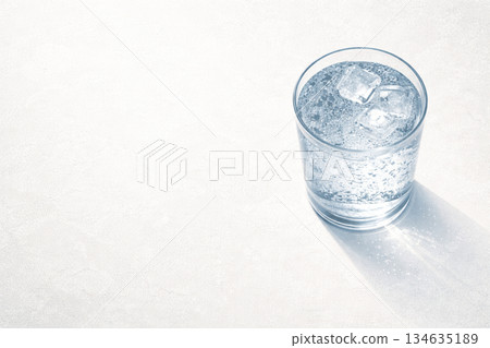 A clean illustration of carbonated water with ice placed on a stone background 134635189