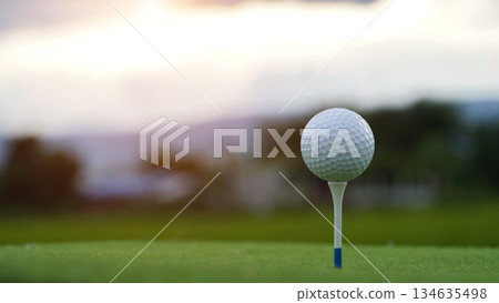 Golf clubs and golf balls on a green lawn in a beautiful golf course with morning sunshine. Golf clubs and golf balls on a green lawn in a beautiful golf course with morning sunshine. 134635498