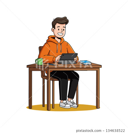 Young man using tablet sitting at wooden desk with coffee cup and book in casual orange hoodie working or studying indoors 134638522
