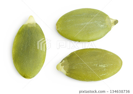 Peeled pumpkin seeds isolated on white background. Top view. Flat lay Peeled pumpkin seeds isolated on white background. Top view. Flat lay 134638736