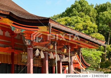 Close-up of the gold bells hanging in the worship area in kiyomizu-dera temple in Kyoto, Japan. Major tourist attraction in Kansai region in Japan. Japan famous historic architecture. 134639197