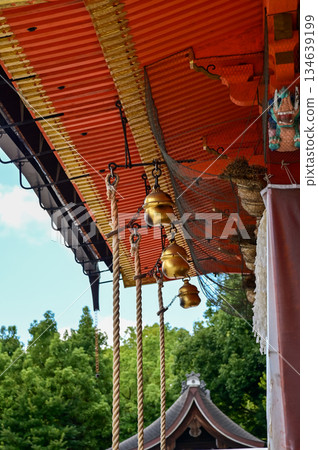 Close-up of the gold bells hanging in the worship area in kiyomizu-dera temple in Kyoto, Japan. Major tourist attraction in Kansai region in Japan. Japan famous historic architecture. 134639199