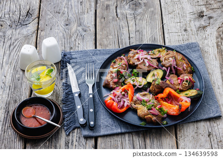 Grilled pork neck chunks with roasted veggies Grilled pork neck chunks with roasted veggies 134639598