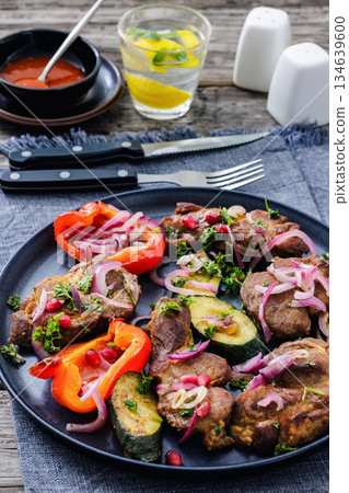 Grilled pork neck chunks with roasted veggies Grilled pork neck chunks with roasted veggies 134639600