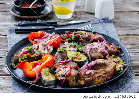 Grilled pork neck chunks with roasted veggies Grilled pork neck chunks with roasted veggies 134639601
