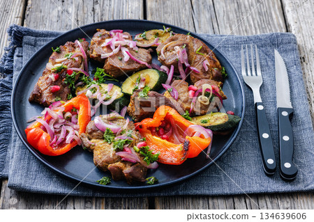 Grilled pork neck chunks with roasted veggies Grilled pork neck chunks with roasted veggies 134639606