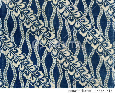 Traditional Japanese "katazome" (stencil dyeing) with a wisteria pattern, and retro indigo dyeing in Japan blue 134639617