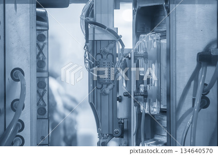 Close up scene material handling process the food container by robotic system from injection machine. 134640570
