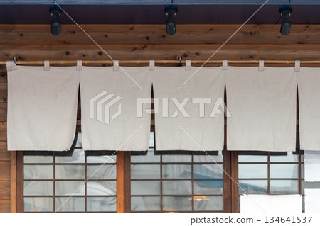 The curtain-like fabric that hangs in front of traditional Japanese restaurants and shops not only serves as a signboard, but holds a larger meaning, 134641537