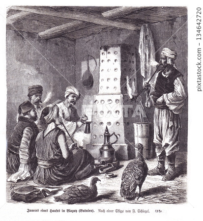 Old Bosnian Interior Scene With Men, Fire, And Birds Around A Tall Hearth Stove 134642720